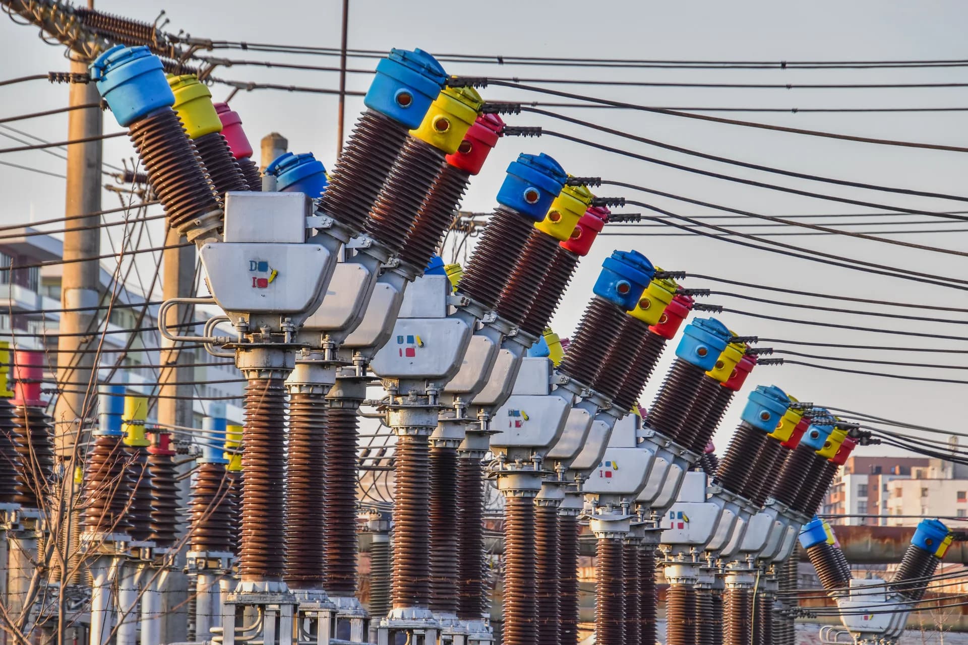Outdoor electrical substation equipment and overhead conductors