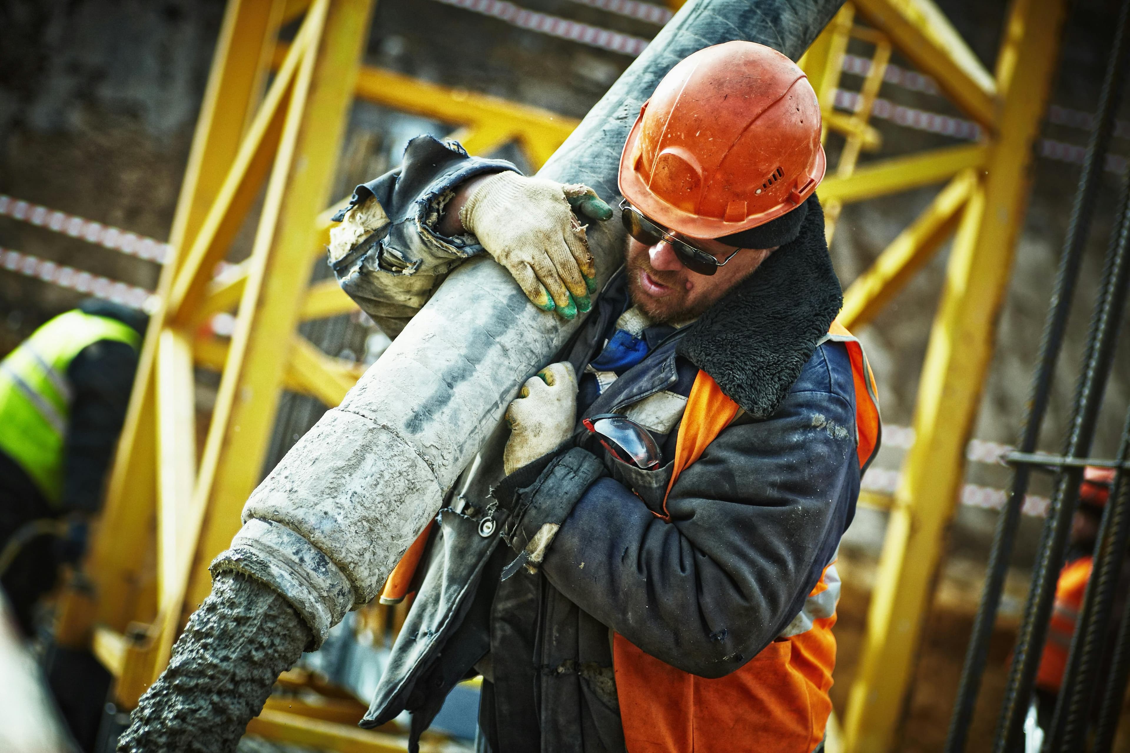 Concrete, crane, and site activity managed with field discipline